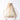A cream colored backpack on a white background. 