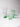 A set of colorful green glasses on a white background