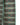 A close-up of a woven textile with a geometric check pattern in mint green, dusty pink, and black, shown against a plain white background.