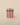 A small cylindrical lidded box with vertical stripes, featuring a peach and black striped lid with a pale yellow spherical knob, and a mint green body with alternating red and mint green stripes, set against a solid beige background.