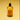 A 50ml bottle of 'dilo' Satsuma Oud Eau de Parfum with amber-colored liquid, a black spray nozzle, and an orange label, set against a warm yellow gradient background.