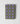 Folded green fabric with purple square patterns on a light gray background