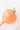 Peach glass watering globe on a white background. 