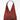 A red shoulder bag on a grey background. 