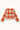 A cropped knit sweater with a red and beige checkered plaid pattern, shown from the back on a light cream background.