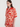 Woman wearing a red and white patterned shirt on a white background