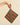Colorful striped pot holder held by a hand against a beige background