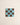 Square tile with a grid pattern of blue and brown squares on a beige background
