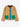 A quilted jacket in camel beige with a vertical blue placket, green front pockets, and a dark burgundy inner collar, shown flat on a white background.