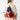 A model wearing a multi color backpack on a white background. 