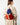 A model wearing a multi color backpack on a white background. 