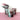 Purple and mint colored tumblers on a pink surface with a white background