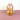A pink and yellow glass vase on a pink surface and white background