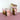 colorful pink and brown tumbler on a pink surface with a white background