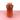 a red vase on a pink surface and white background