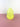 A yellow glass vase on a pink surface and white background